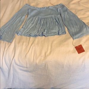 light blue off-the-shoulder shirt